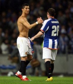 A picture of Cristiano Ronaldo embracing a Porto player for Manchester United in a Champions League quarter final in Portugal in 2009