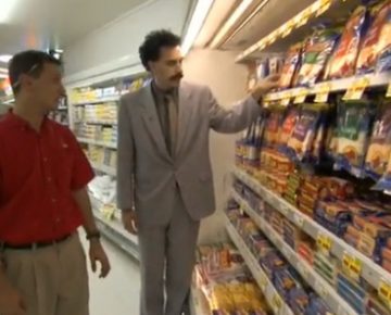 Two men looking at frozen product in a supermarket