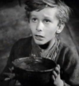 A still from the 1948 Oliver Twist film, depicting the protagonist holding a bowl