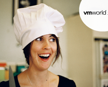 A photo of a woman in a chef's hat smiling