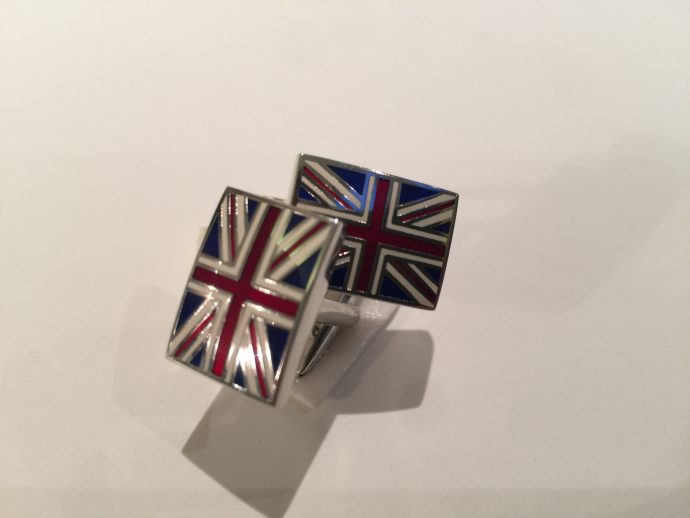 A pair of cufflinks in the form of the UK flag