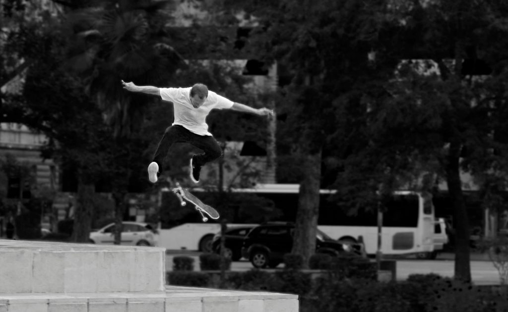 man doing skateboarding trick - the new different