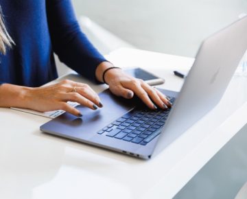 person using laptop working in B2B Tech PR